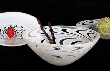 White Swirly Bowl - A beautiful bowl in the family of pattern themed objects	featuring a swirly motif.

TECHNIQUE 
blown glass /